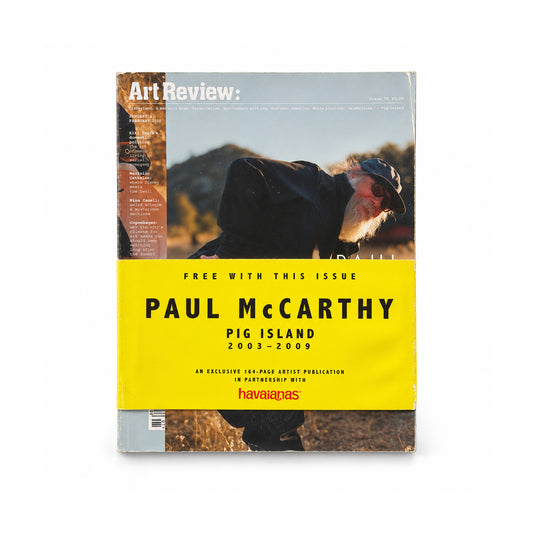 Front of ArtReview issue 38 with Paul McCarthy Pig Island supplement and yellow Havaianas belly band